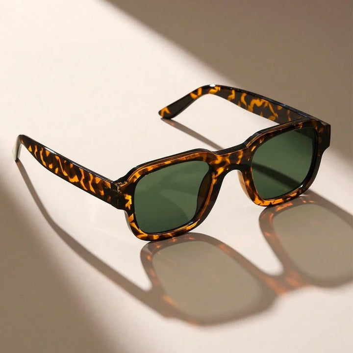 Leopard print retro bold frame sunglasses. Unisex shades with full UV protection for a fashion-forward look.