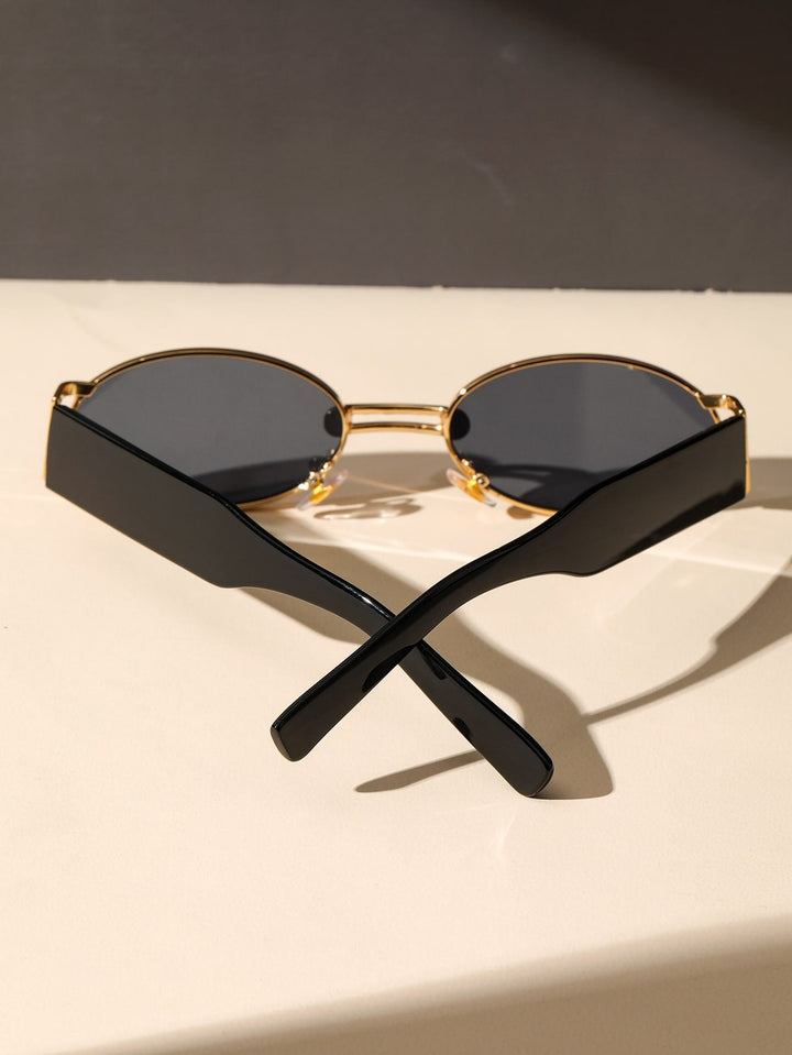 Close-up of sleek retro modern sunglasses. Black frames, UV protective lenses for all.