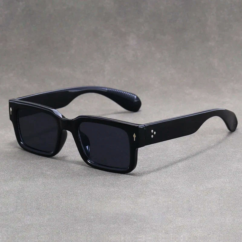 Stylish unisex retro rectangular sunglasses ensuring 100% UV protection. Essential eyewear accessory.