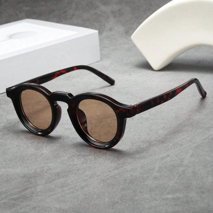 Unisex retro sculpted round sunglasses, vintage fashion eyewear with UV protection.