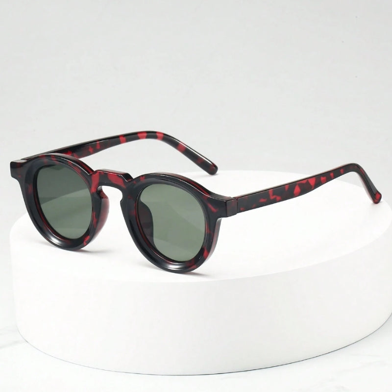 Vintage-inspired unisex sculpted round sunglasses, perfect fashion accessory with UV shield.