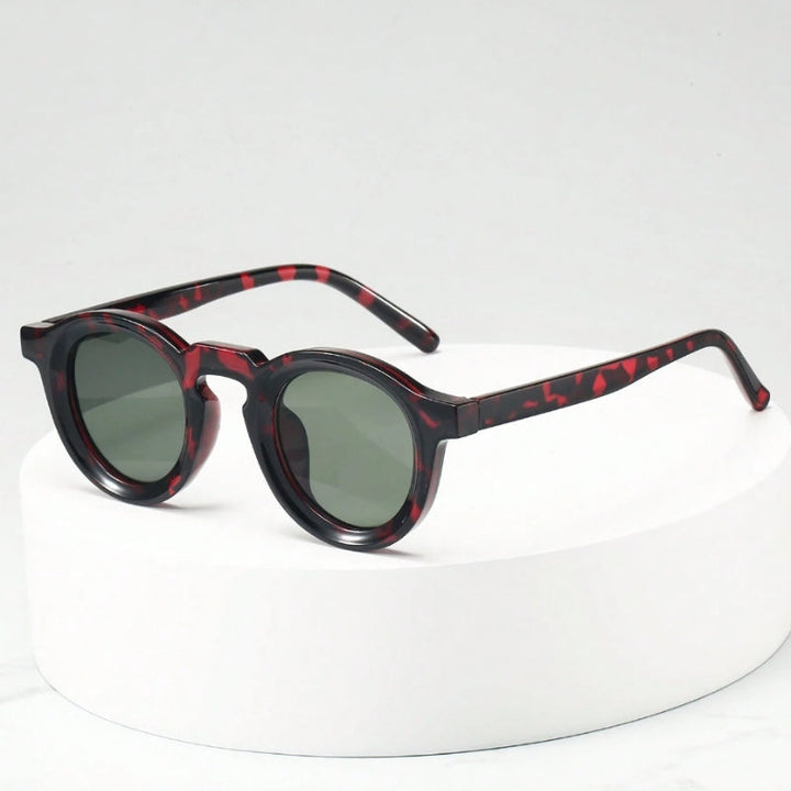 Vintage-inspired unisex sculpted round sunglasses, perfect fashion accessory with UV shield.
