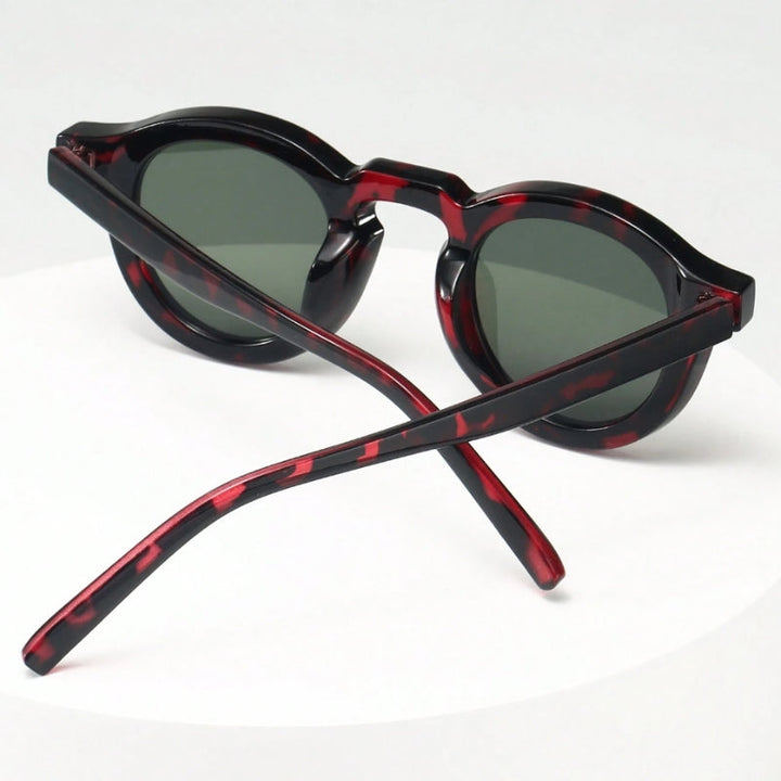 Fashionable unisex retro sculpted round sunglasses, vintage eyewear for sun protection.