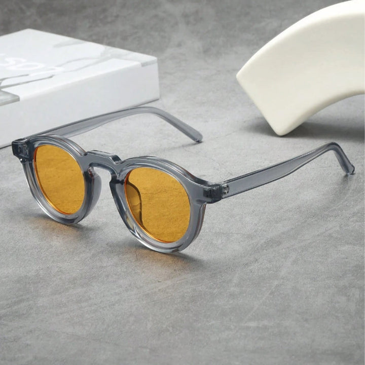 Sculpted round retro sunglasses, unisex design for stylish UV protection & vintage look.