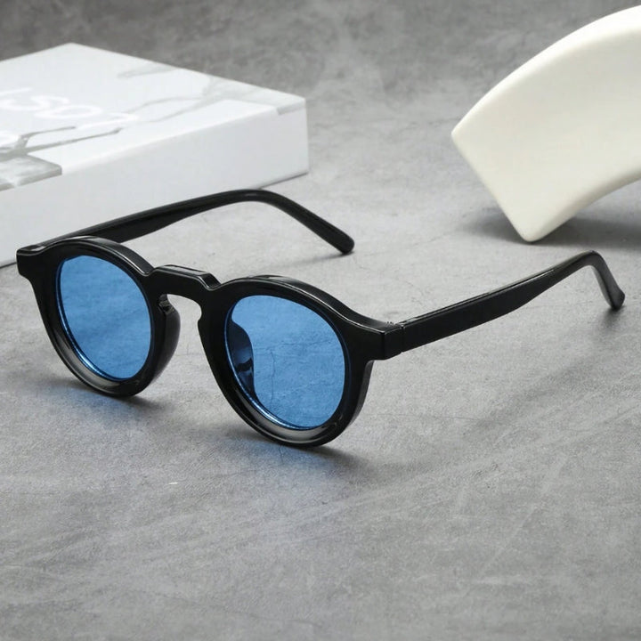 Unisex retro round eyewear, sculpted shades offering vintage style & UV protection.