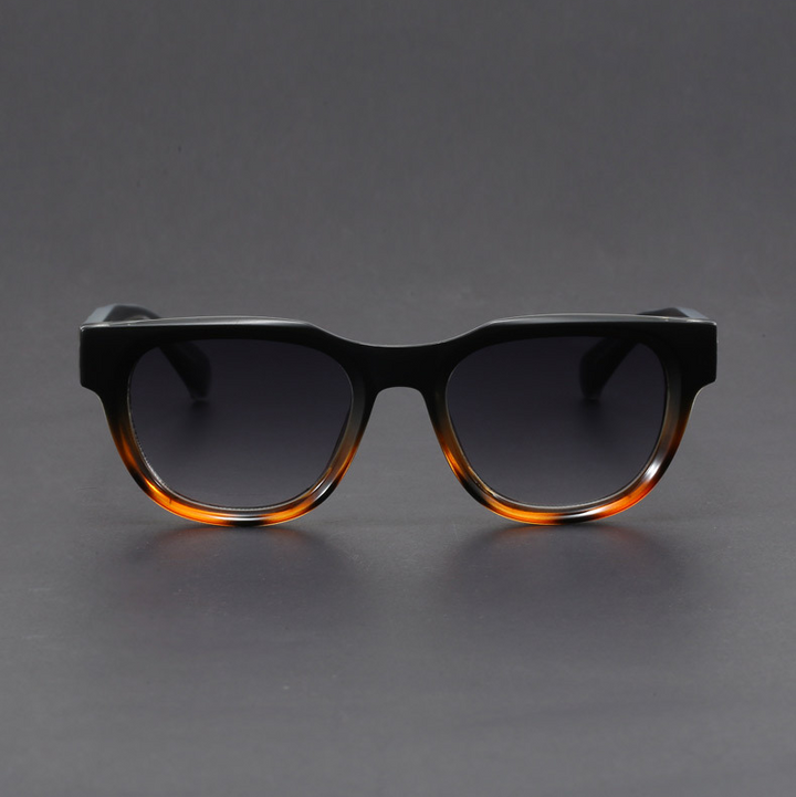 Black retro square polarized sunglasses. Unisex design with UV400 lenses, blending vintage style & modern protection.