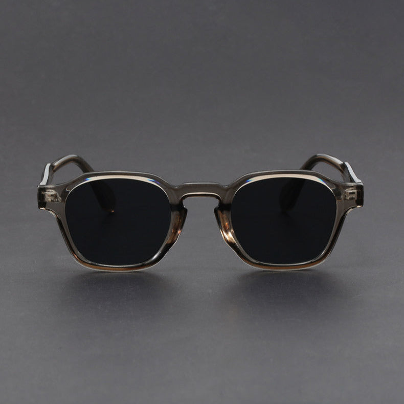 Unisex retro square sunglasses in a close-up, highlighting the durable frame and UV protection lenses.