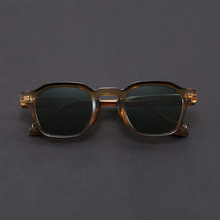 Lightweight polycarbonate retro square sunglasses for unisex wear. Durable & stylish, offering full UV protection.