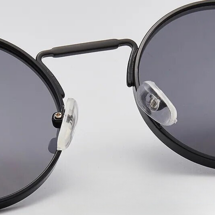 Stylish unisex retro sunglasses for eye protection, featuring a classic vintage design.