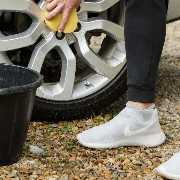 Durable unisex waterproof shoe covers for all-season foot protection against rain, mud & snow; ideal travel gear.