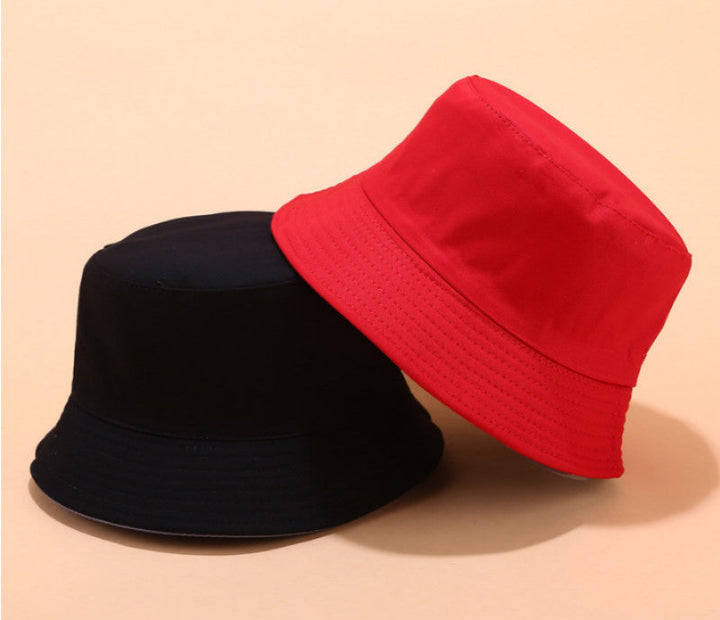Unisex Reversible Summer Bucket Hat in solid color, perfect for beachwear and sun protection