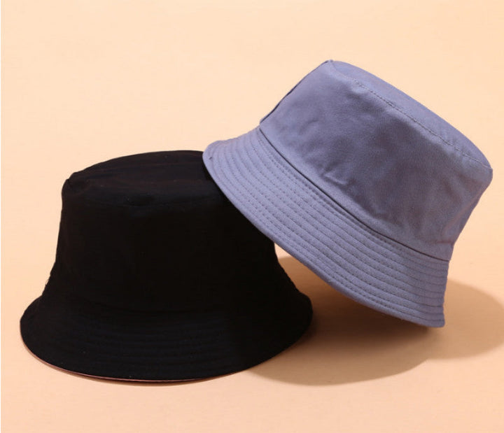 Two-in-one unisex bucket hat, showcasing both reversible sides, ideal for summer and travel