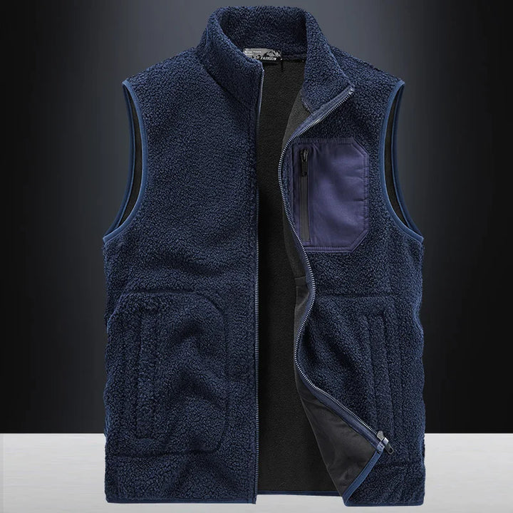 Model wearing a warm unisex Ridge fleece vest. Stylish and cozy layering piece for casual everyday comfort.