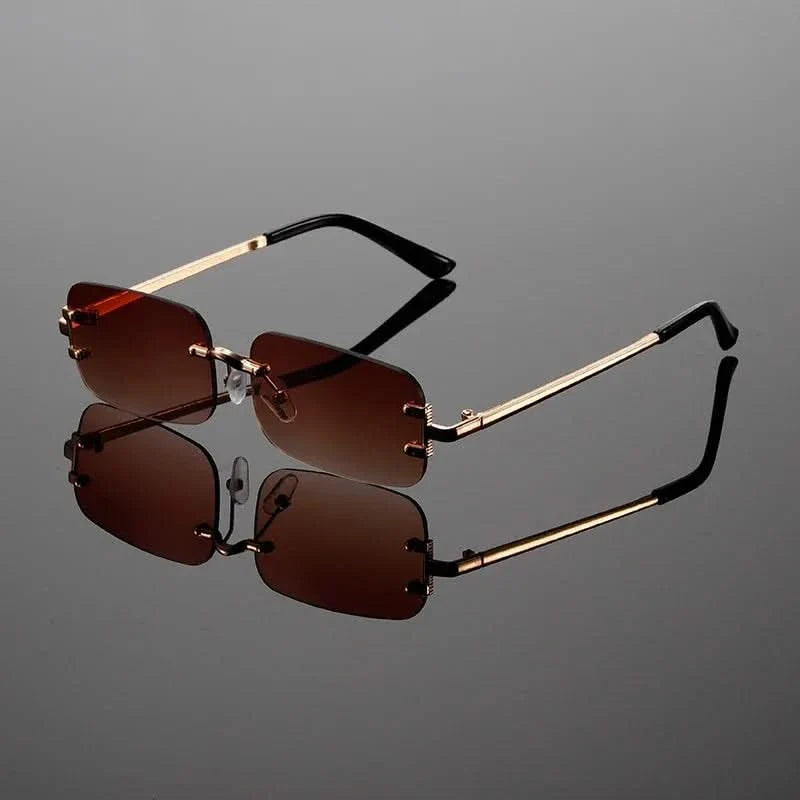 Anti-glare rimless sunglasses featuring a lightweight metal frame, designed for comfortable unisex wear.