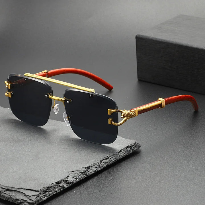 Unisex rimless sunglasses with intricate dragon engraving & 100% UV protection. Stylish, lightweight fashion eyewear.