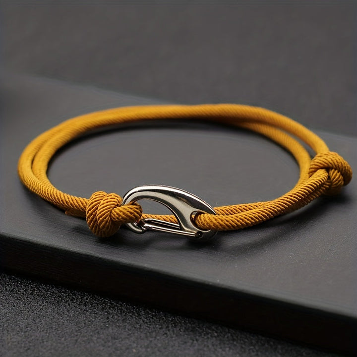 Unisex rugged rope bracelet with secure silver hook clasp, adjustable for durable everyday wear.