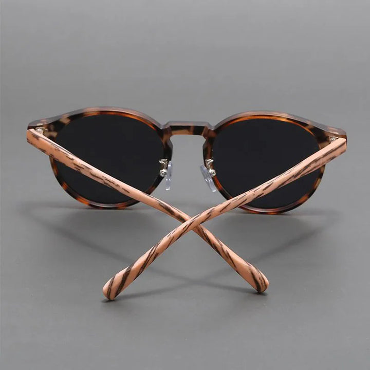 Modern Sahara shades, unisex design, offering full UV protection & scratch resistance.
