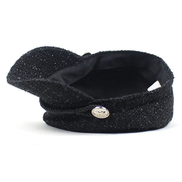 Close-up of a textured Savanna cotton cap, highlighting its vintage flair and woven design. Casual headwear.