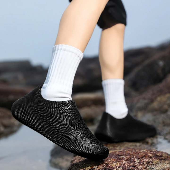 Lightweight athletic running shoes, water resistant for outdoor comfort.