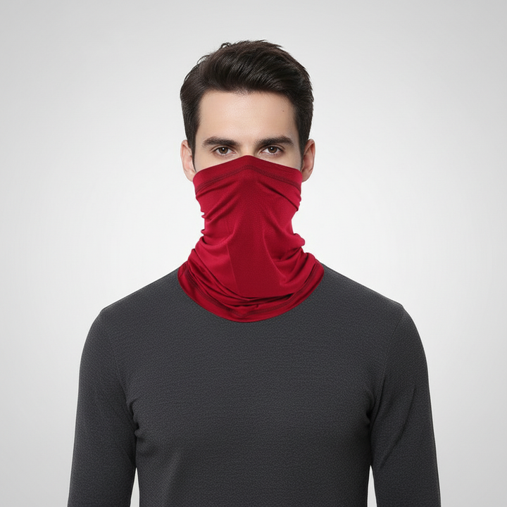 Flat lay of a seamless polyester neck warmer tube scarf next to winter gear, highlighting its outdoor utility.