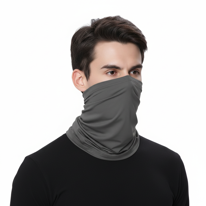 Stack of varied colored seamless polyester neck warmer tube scarves, emphasizing their unisex appeal and versatility.