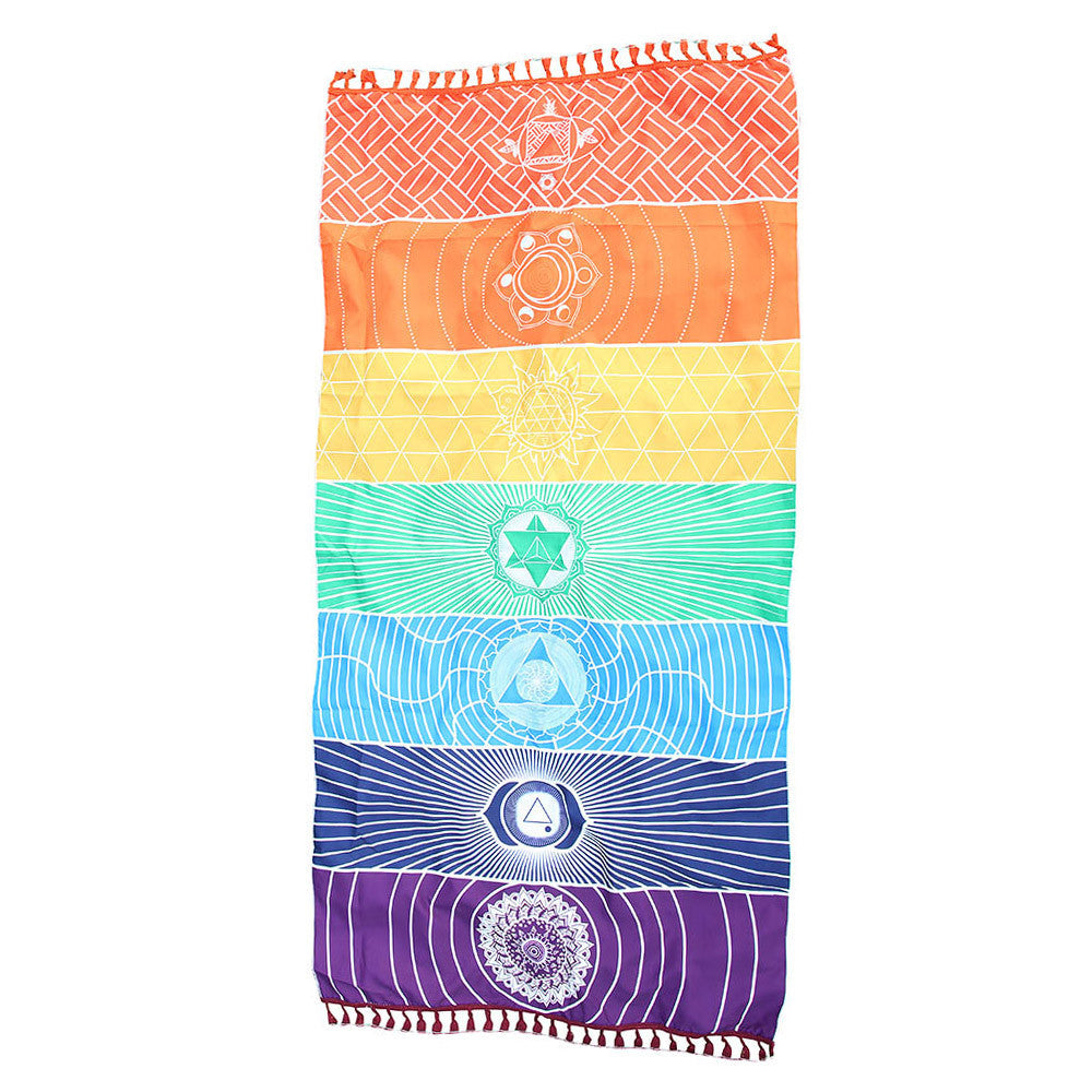 Close-up of vibrant seven chakra symbols on a soft polyester blanket. Energy balancing spiritual decor.