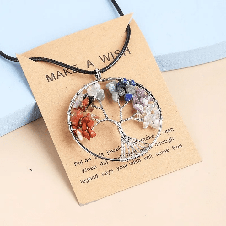 Stainless steel Tree of Life necklace with seven chakra gemstones. Unisex spiritual healing jewelry.