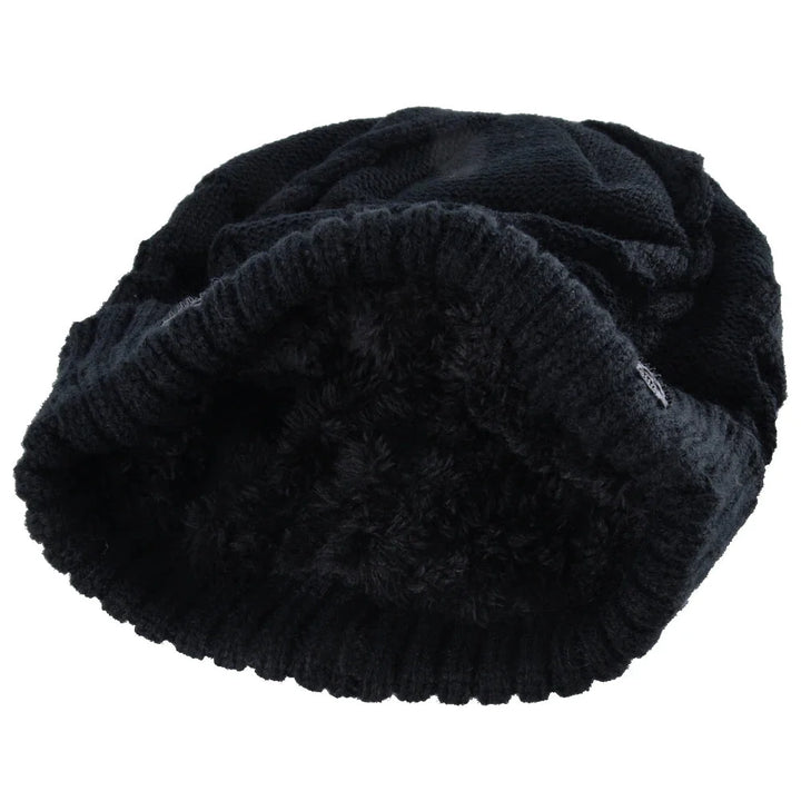 Stretch-fit unisex beanie showcasing unique metallic skull embellishments. Great for winter.