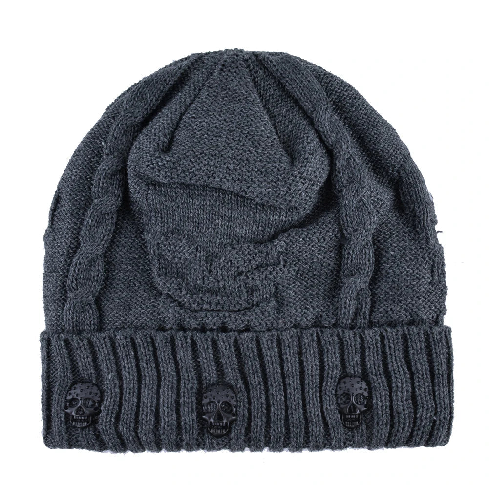 Fashionable skull cap for unisex wear, detailed with striking metallic skulls. Cozy winter accessory.