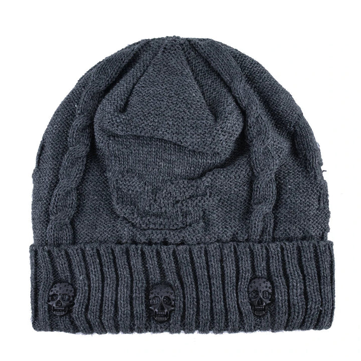 Fashionable skull cap for unisex wear, detailed with striking metallic skulls. Cozy winter accessory.