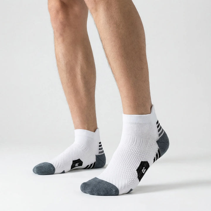 Multiple pairs of unisex cushioned ankle sports socks, non-slip for running, training, and athletic activities.