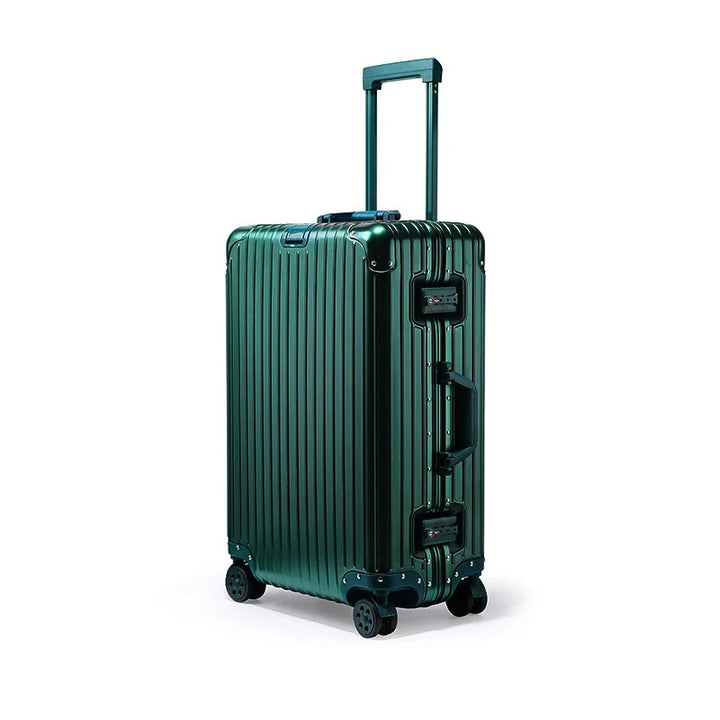 Close-up of brushed aluminum hard shell luggage, highlighting its durable metal construction & sleek design.