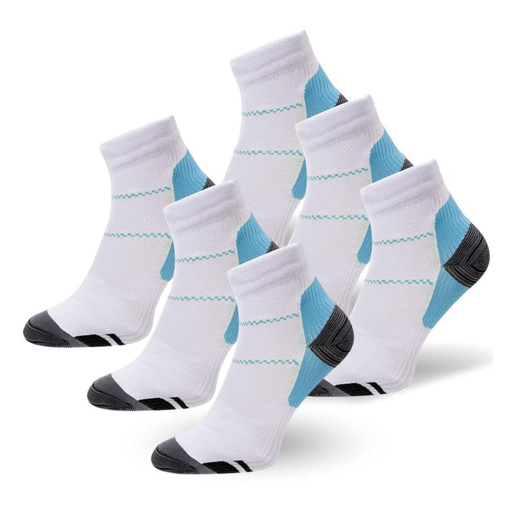 Person wearing black SlimSupport PRO 2.0 compression socks for foot pain relief & improved circulation.
