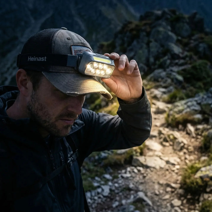 Unisex smart sensor clip-on cap headlamp with hands-free LED light for outdoor activities.