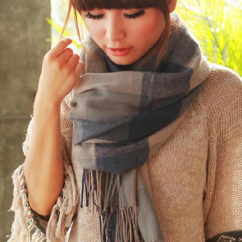 Close-up of the intricate diamond pattern on a soft cashmere unisex scarf, premium quality.