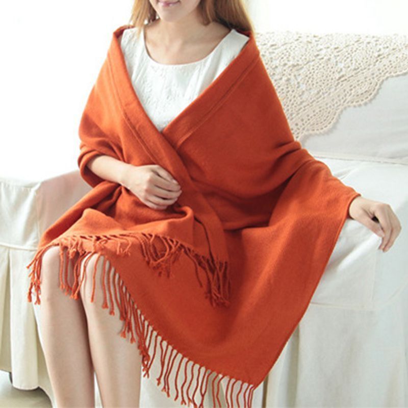 Model wearing a warm cashmere diamond pattern scarf, showcasing its unisex style and comfort.