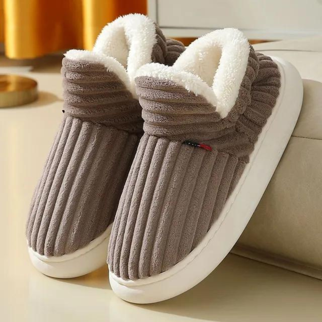 Plush, warm indoor slippers, comfortable unisex design for home relaxation and cozy winter days.