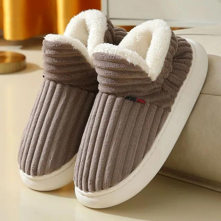 Plush, warm indoor slippers, comfortable unisex design for home relaxation and cozy winter days.
