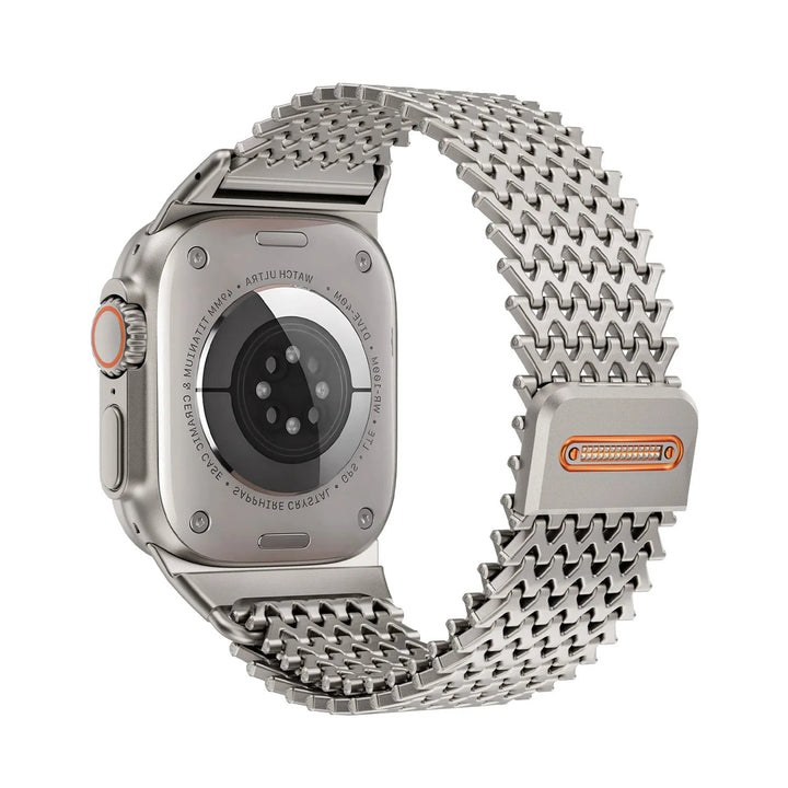 Sleek unisex stainless steel watch band on a wrist. Magnetic link design offers comfortable, adjustable fit.