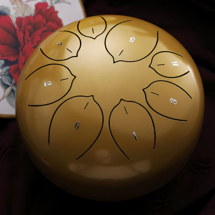 Portable steel tongue drum, ideal for relaxation, meditation & sound healing. Calming musical percussion.