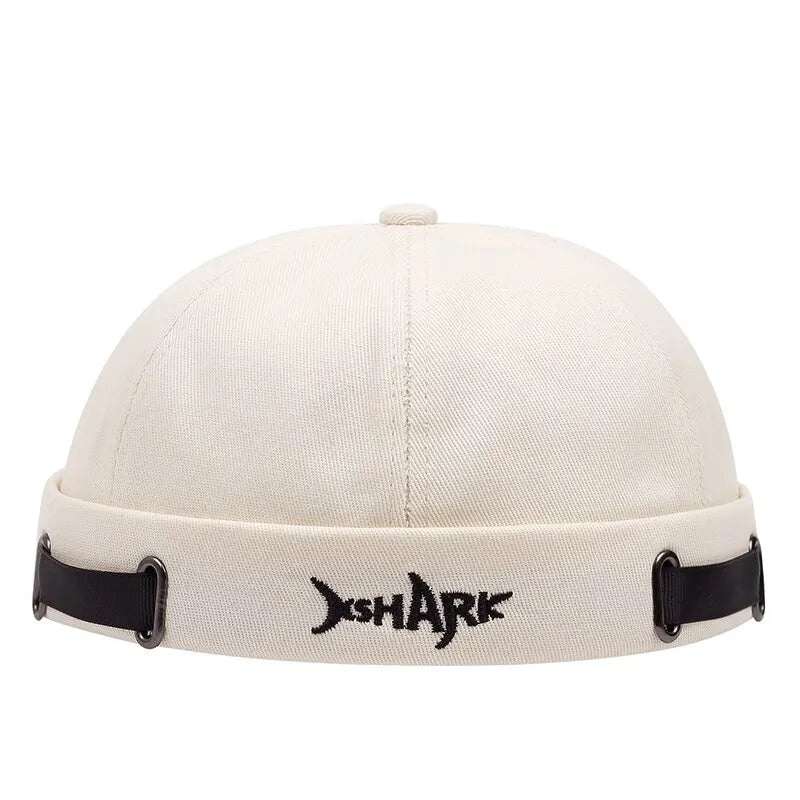 Black unisex streetwear beanie with a prominent embroidered shark. Ideal for edgy urban fashion.