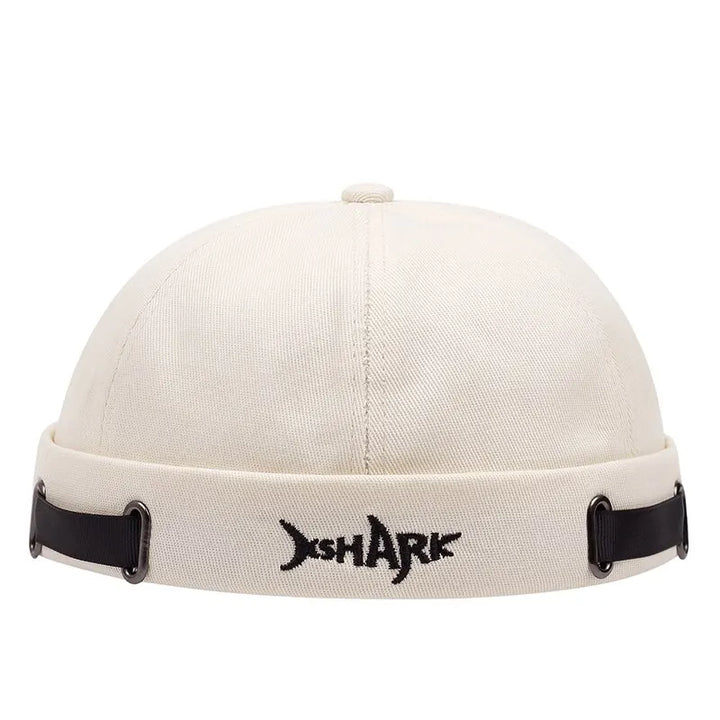 Black unisex streetwear beanie with a prominent embroidered shark. Ideal for edgy urban fashion.