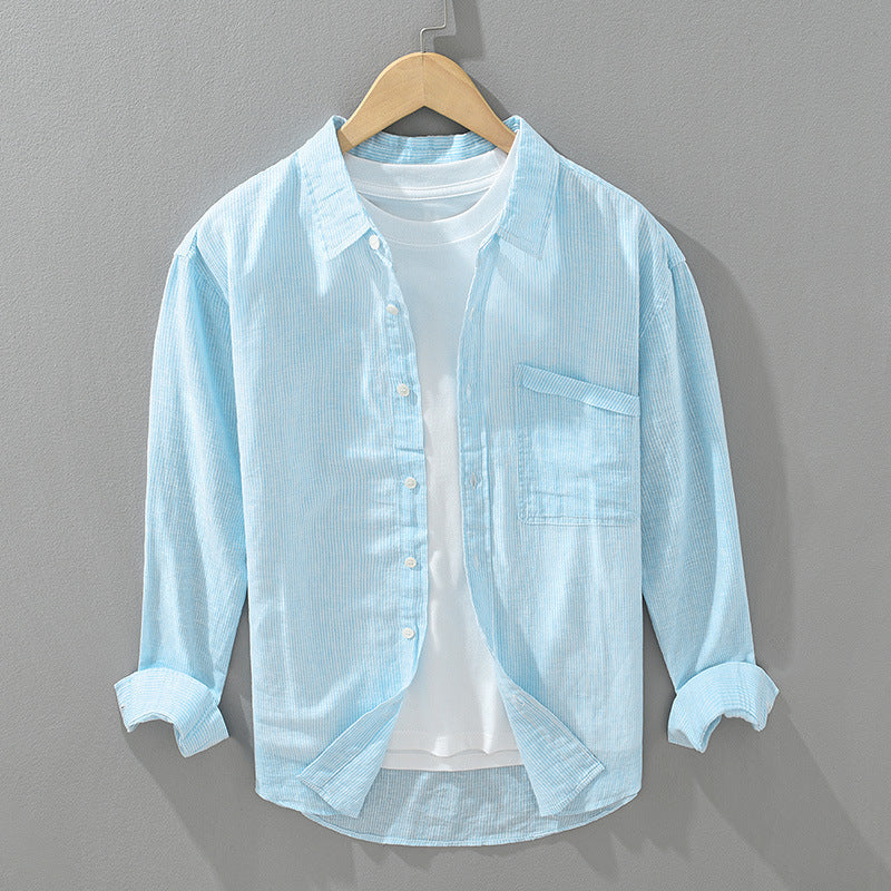 Unisex striped shirt, lightweight & comfortable for everyday wear. Button-down, textured fabric.