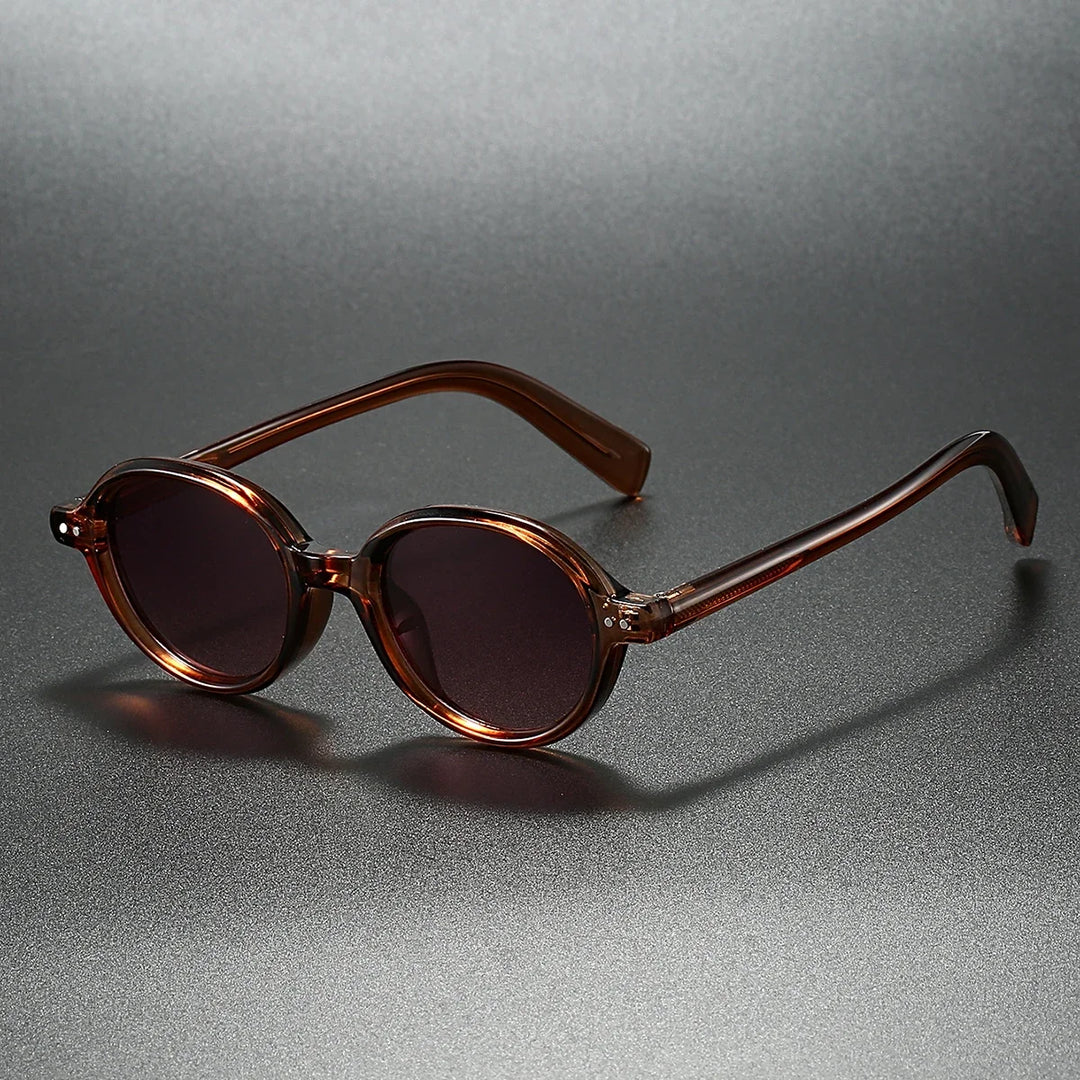 Stylish unisex round sunglasses with UV blocking lenses. Modern retro fashion accessory, perfect for sun protection.
