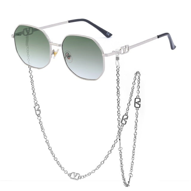 Elegant side view of unisex round sunglasses. Showcases a sleek alloy frame and UV400 polycarbonate lenses.