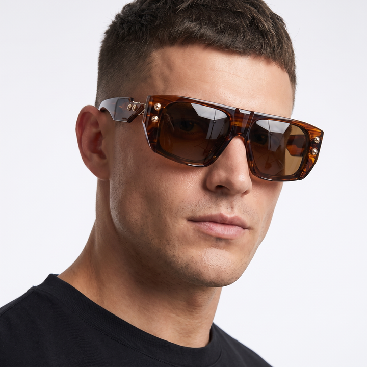 Modern unisex sunglasses, crystal-studded frames provide stylish UV protection for any outfit.