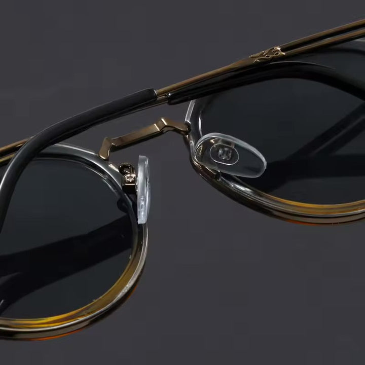 Blue tortoise metal frame sunglasses offering unisex UV protection. Fashionable anti-glare eyewear for daily use.
