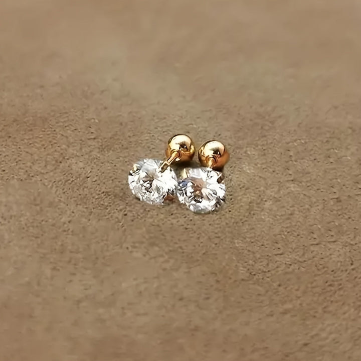Minimalist unisex stud earrings with a single zirconia, made from durable titanium steel for elegant everyday wear.