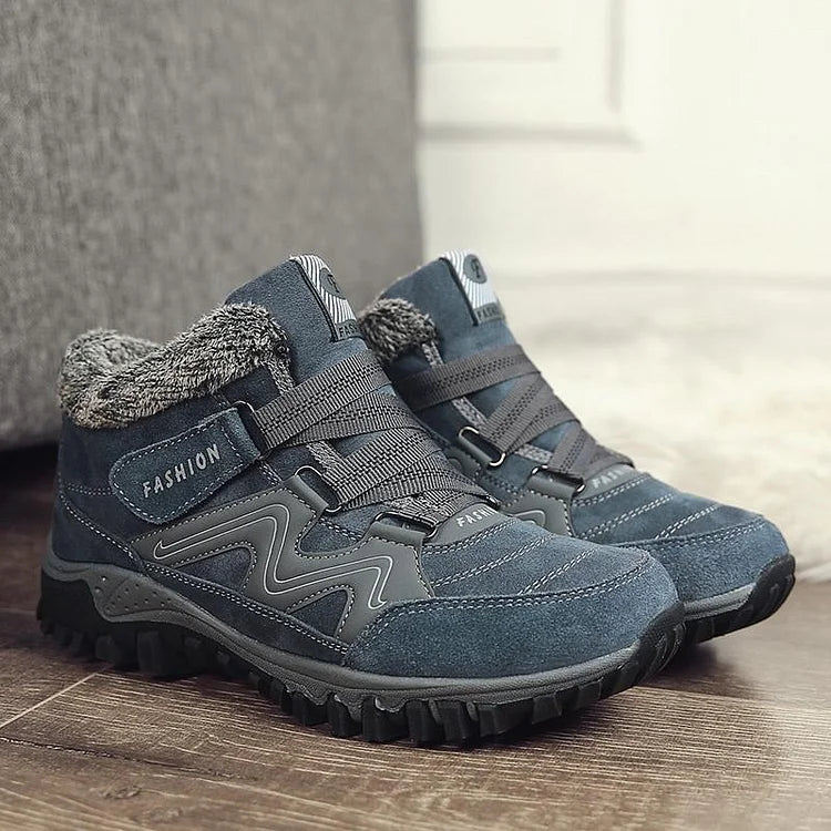Rugged AlpineWarm winter boots for men & women, offering exceptional warmth & high-grip traction for trails.
