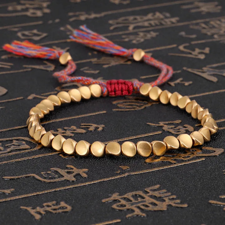 Unisex Tibetan Buddhist Harmony bracelet with natural stone beads. Handcrafted spiritual jewelry for peace & meditation.